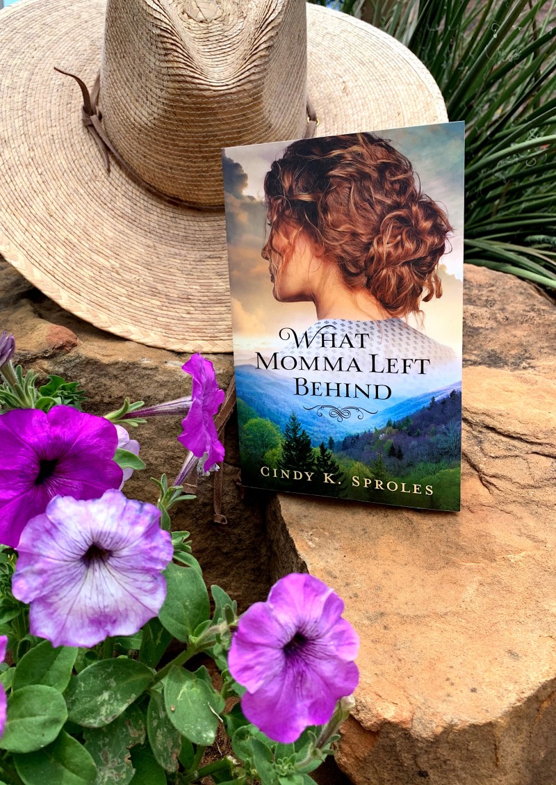 Book with hat and flowers