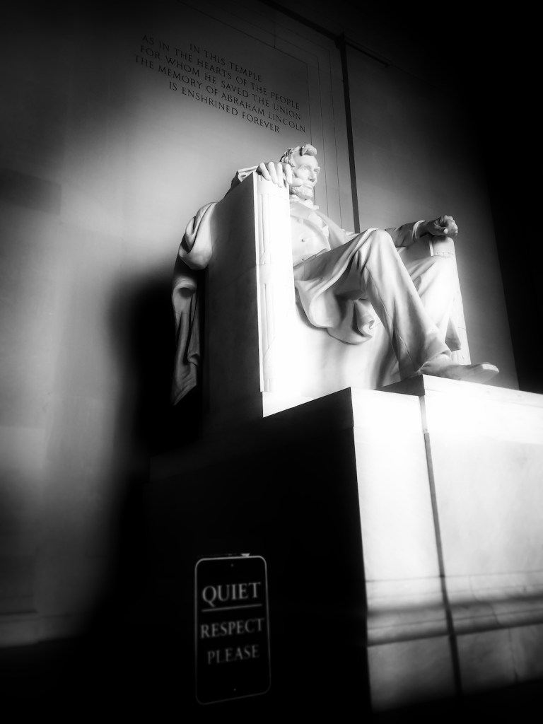 Close up image of the Lincoln Memorial in black and white. 